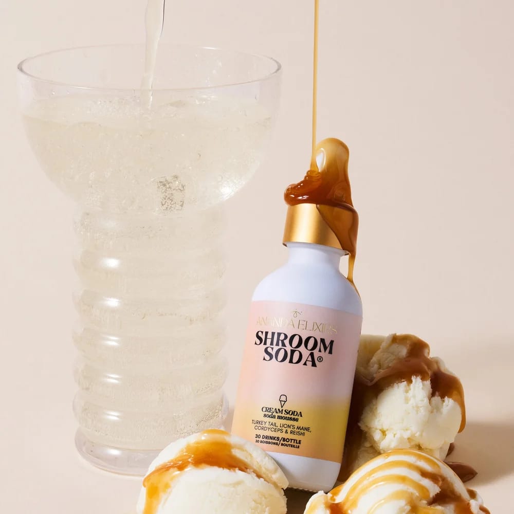 Shroom Soda bottle and a fizzy glass